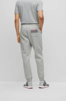 Cotton-blend tracksuit bottoms with embroidered logos 