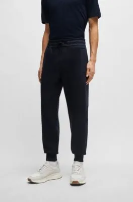 Tracksuit bottoms with mesh trims