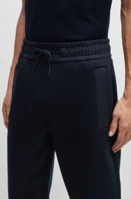 Tracksuit bottoms with mesh trims