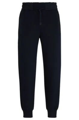 Tracksuit bottoms with mesh trims